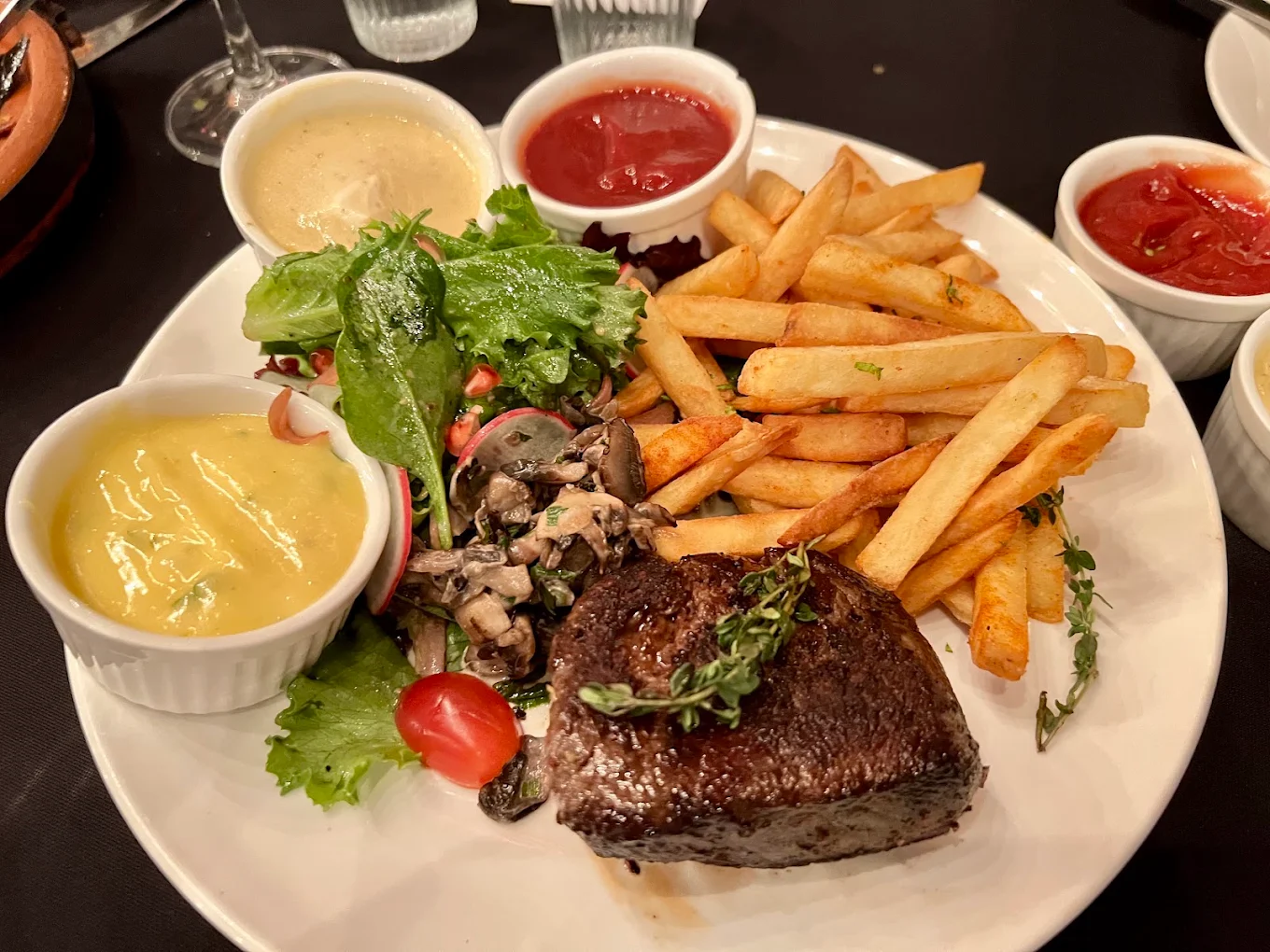 Steak frites with sauces and salad